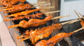 Grilled chicken on the grill roadside of Thailand
