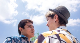 two men smiling at each other